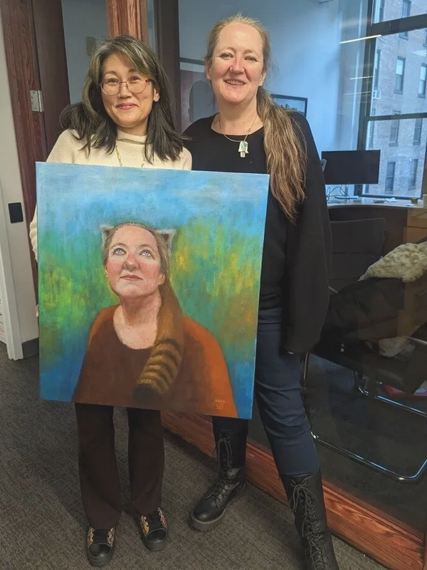 Two people, one holding a portrait, oil on canvas. Artwork by Sophia Chicuzo. 2023.