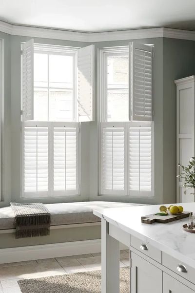 Double Hung Shutters in Bay Window.  Uppers are open.