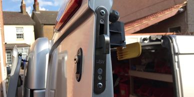 Open silver van door exposing lock