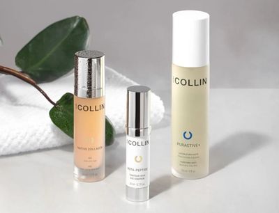 Three skincare bottles from Collin displayed with a green leaf and white towel.