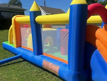 The obstacle course ends in a soft landing slide. 