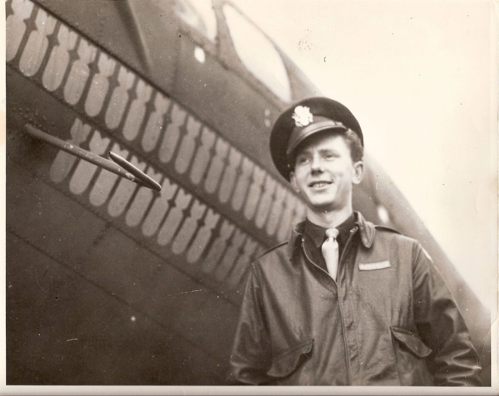 Colonel Richard Bushong standing in front of his B-17 "Geronimo" 