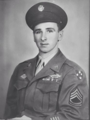 Black and white portrait of a young soldier in uniform.