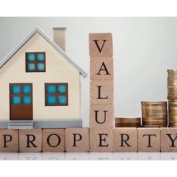 Model house, wooden blocks spelling 'PROPERTY' and 'VALUE', and stacks of coins.