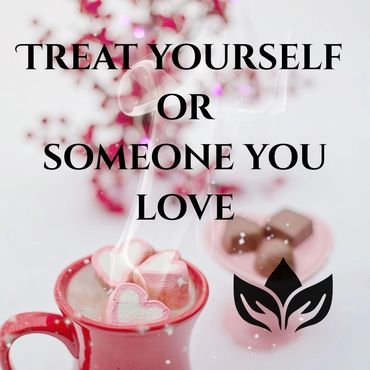 A hot chocolate filled mug with heart-shaped marshmallows