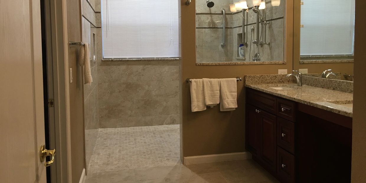 Barrier Free Roll In Shower in a wheelchair accessible bathroom with roll under sink and spa like amenities.