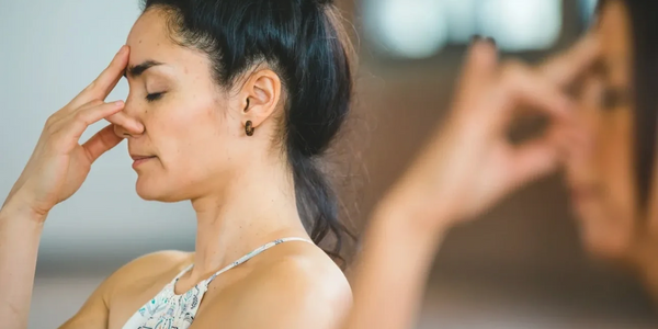 Two ladies doing breathwork