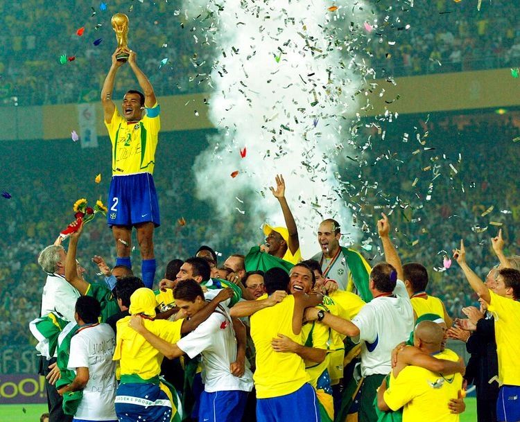 Brazil football team celebrates winning the World Cup trophy.