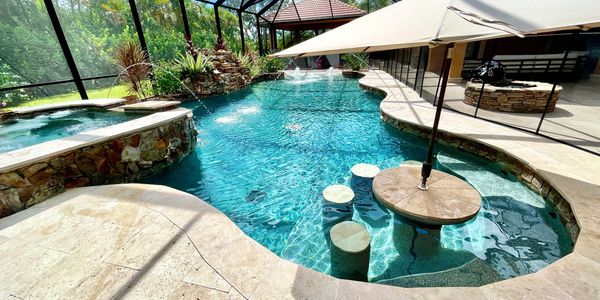 Beautiful swimming pool with water features and wet bar