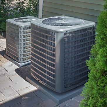 2 AC units installed outside of the house.