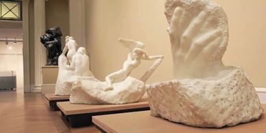 A gallery with several large sculptures on display.
