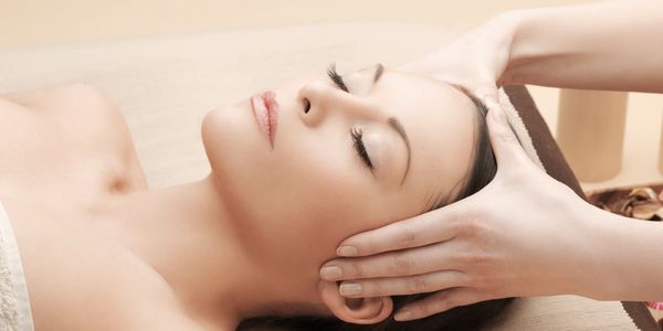 Peaceful woman enjoying a luxury skin spa facial at Salon Serenity Spa, Wake Forest NC 27587