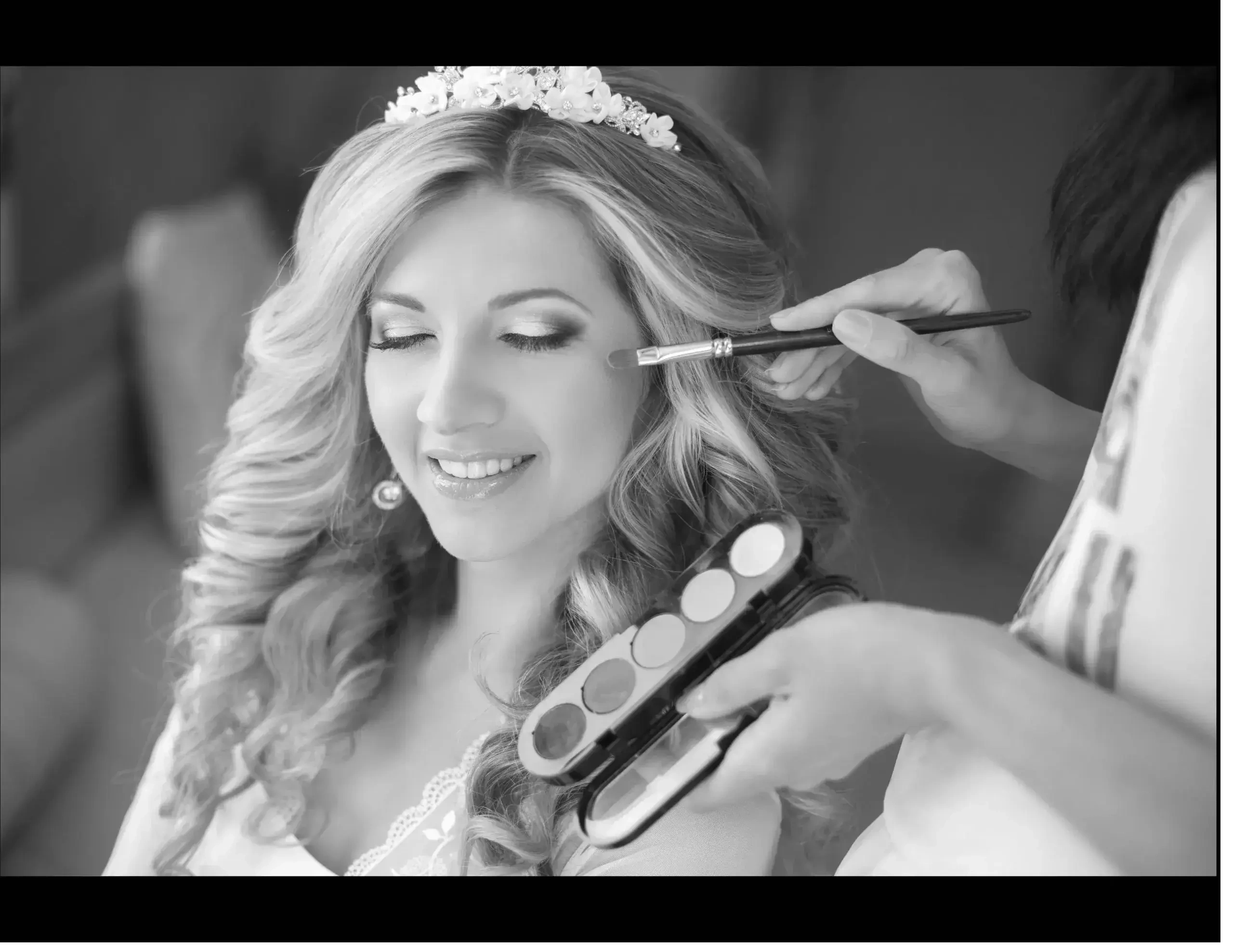 A bride getting flawless wedding makeup at Salon Serenity Spa in Wake Forest, NC for her big day.