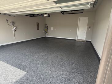 Empty, clean garage with epoxy floor coating.