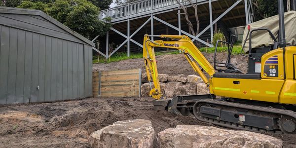 Retaining wall with timber and rock