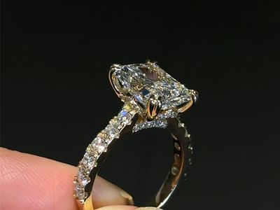 Elegant diamond engagement ring with a large center stone and smaller side stones.