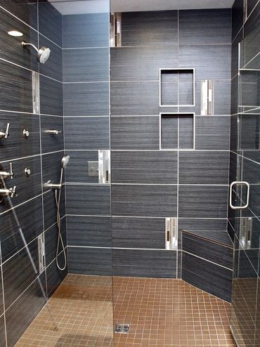 Bathroom Remodel featuring a Walk-In Tiled Shower, multiple shower sprays and schluter waterproofing