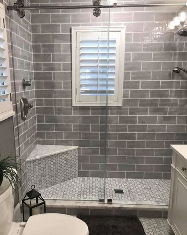Ceramic wall tile shower, subway layout. Carrara hexagon floor tile, bath floor, corner shower seat