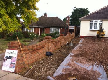 brick wall, driveway under construction