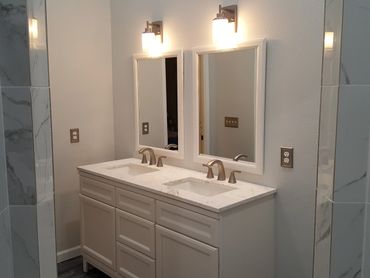 white bathroom vanity with matching mirrors