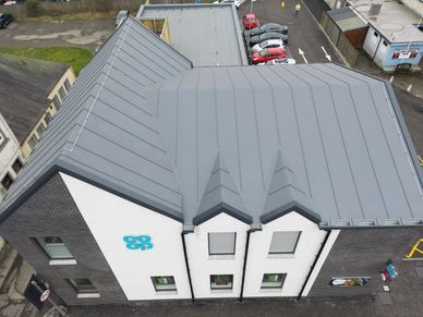Aerial drone view of a commercial building roof for inspection