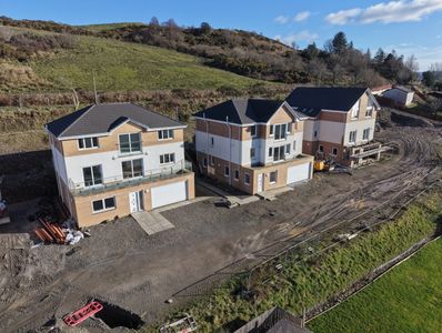 Aerial drone view of residential property development across Scotland