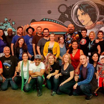 Large group of people at a space themed event