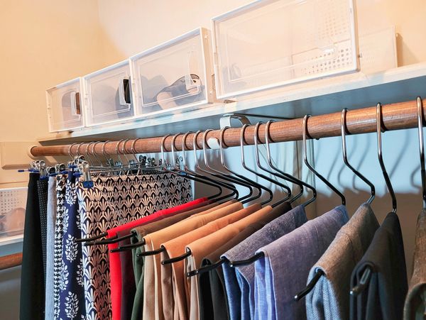 Women’s shoes and clothing unpacked using organizing supplies.