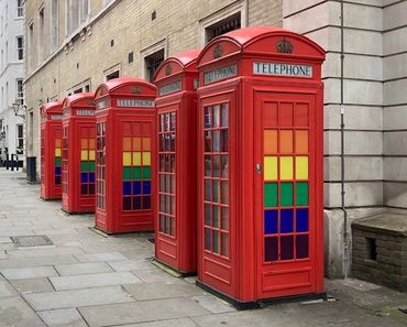 London Pride telephone boxes, London black cab tours, the black cab tours, London, telephones, peopl