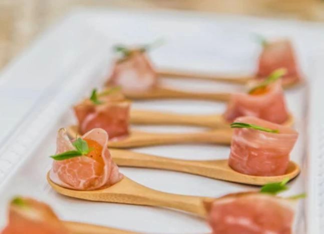 Food Bites - Smoked salmon rolls appetizer presented on edible spoons - Art of the Platter - Orlando