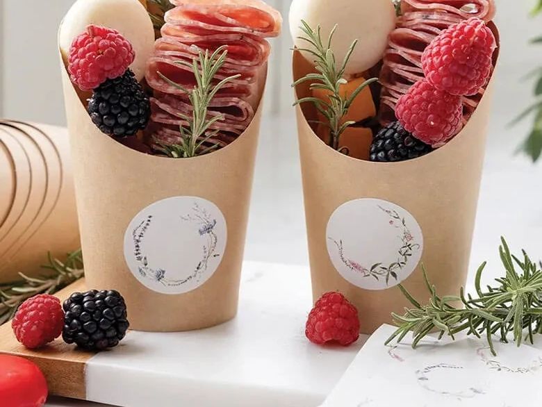 Custom printed craft paper individual charcuterie cups produced by Art of the Platter for a wedding 