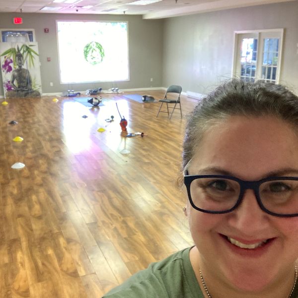 Coach Lynn El-Hillow setting up a workout routine with saber dry fencing.