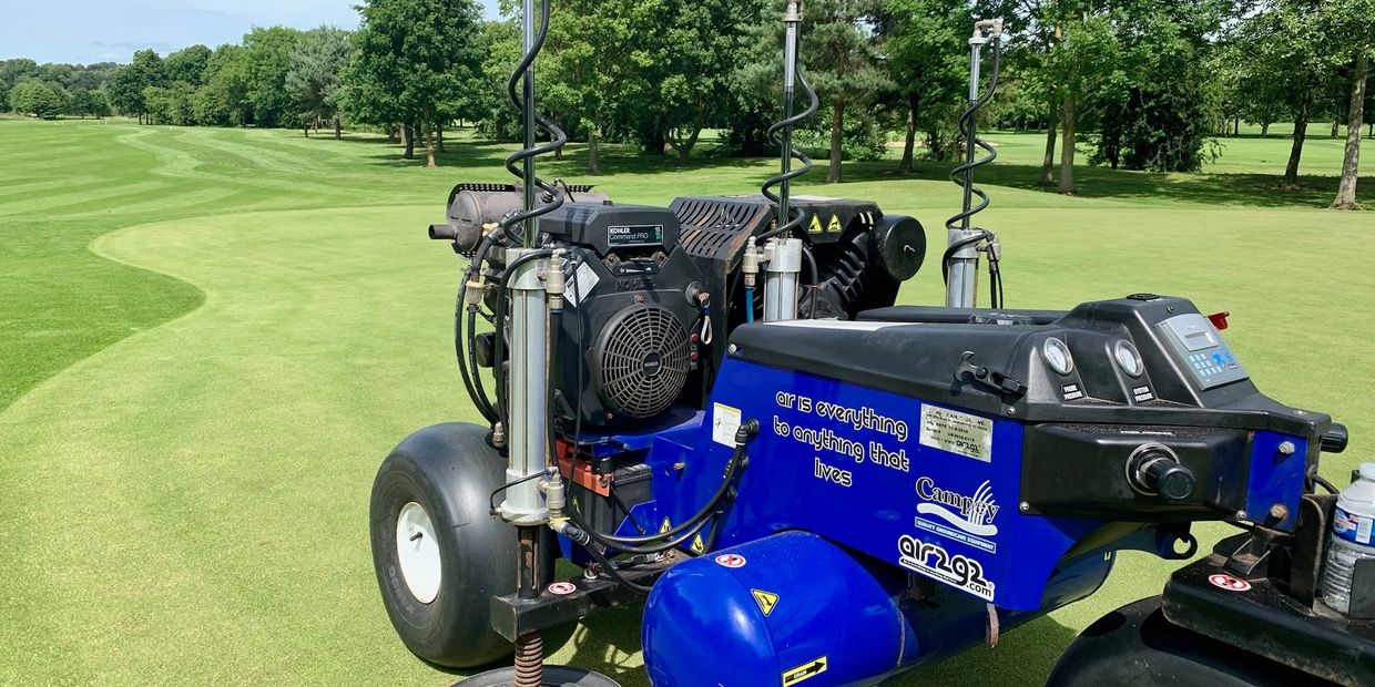 a utility vehicle repairing a golf course.