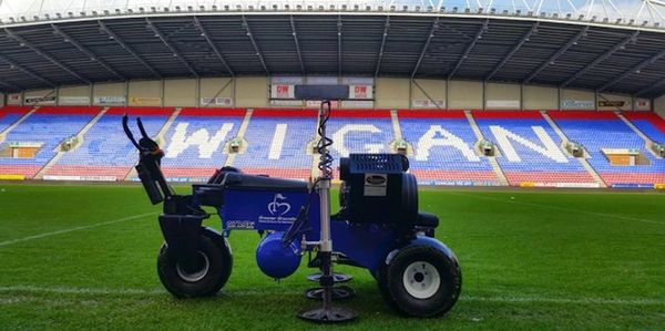 a utility vehicle on a sports field.