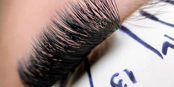 Close-up of thick, long false eyelashes.
