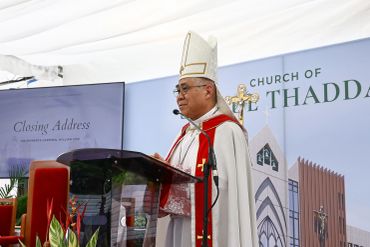 A bishop giving a closing address at a church event.