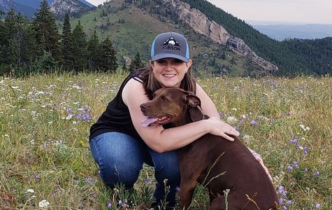 Jen and her dog Bella in the outdoors.