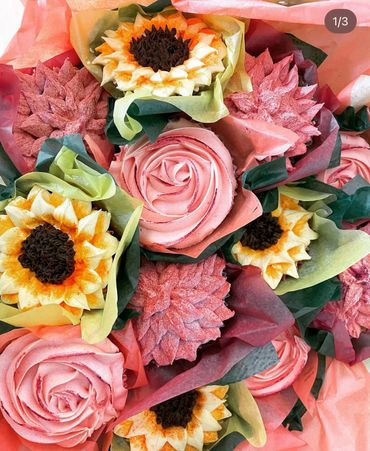Colorful bouquet of flower-themed cupcakes with intricate frosting designs.