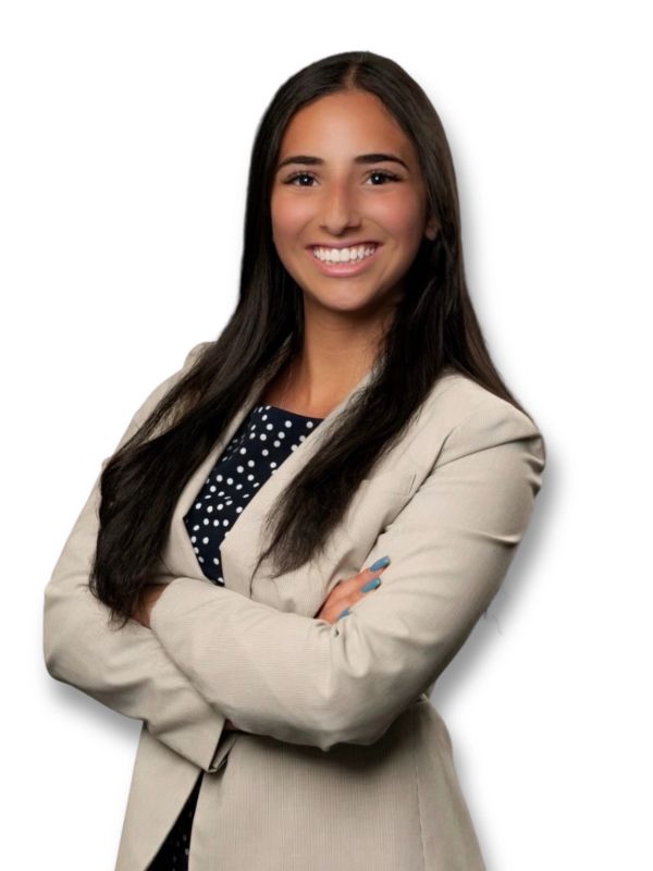 Confident young woman in beige blazer smiling.