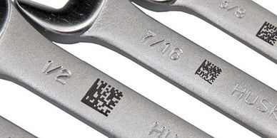 Set of wrenches with QR codes on them.