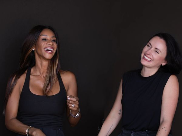 Two women laughing and enjoying each other's company.