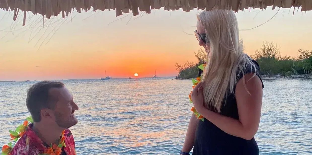 man proposes on a tiki boat adventures Key West sunset cruise and she says yes!