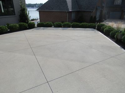 Concrete parking lot in a residential home showing the true quality of the concrete installation.