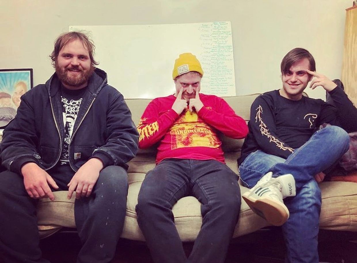 Co-hosts of in-depth, funny hardcore punk and subculture podcast wearing hardcore punk t-shirts