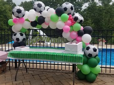 A  Soccer themed organic balloon garland for the dessert table!