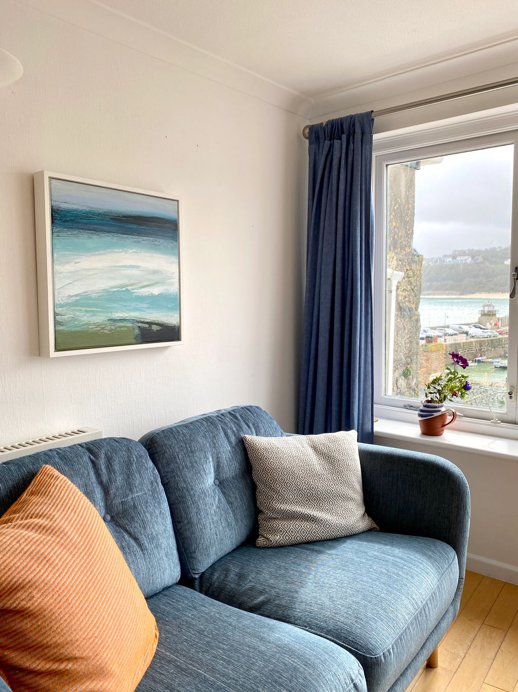 Atmospheric painting inspired by the sea, in a home looking over the harbour