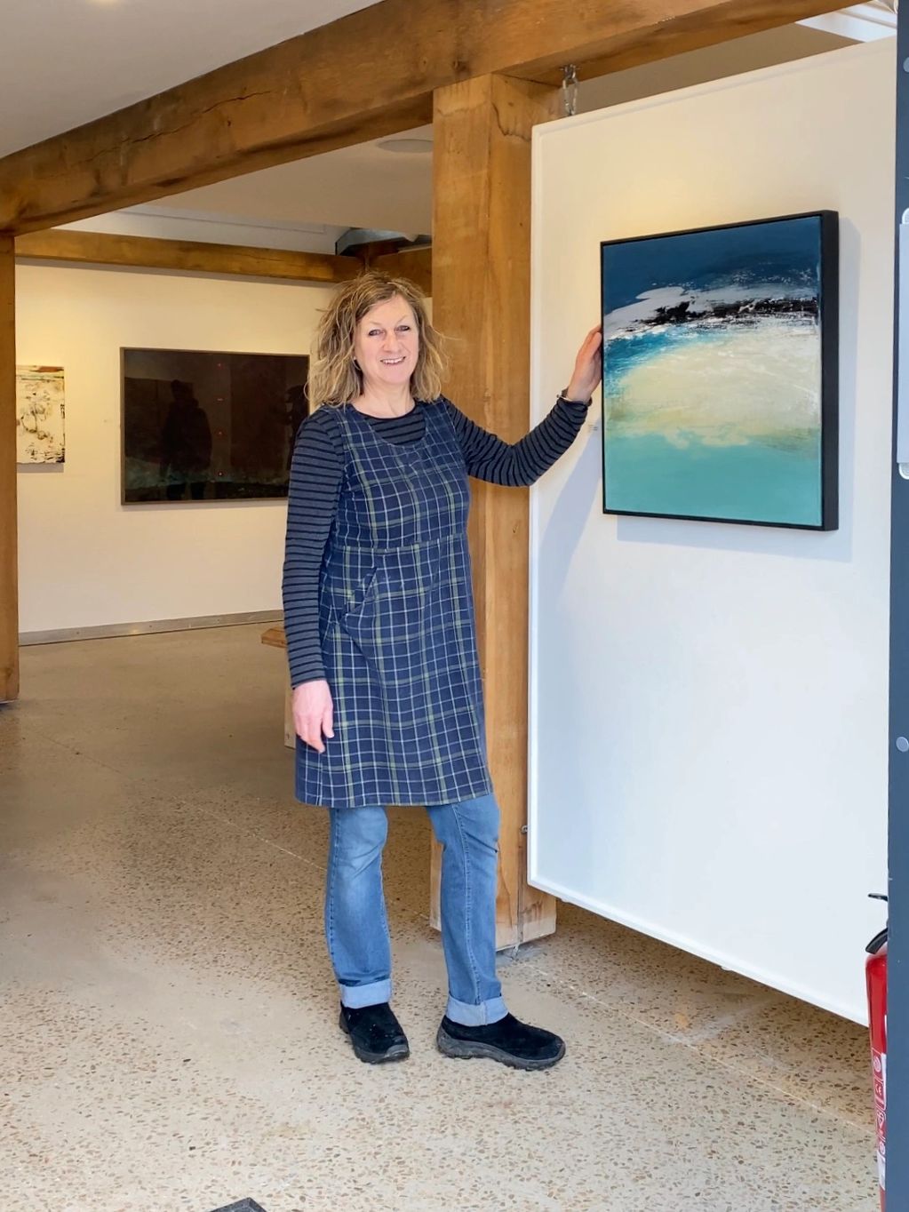 me standing in situ with my 'Shoreline' painting on canvas in a beautiful gallery