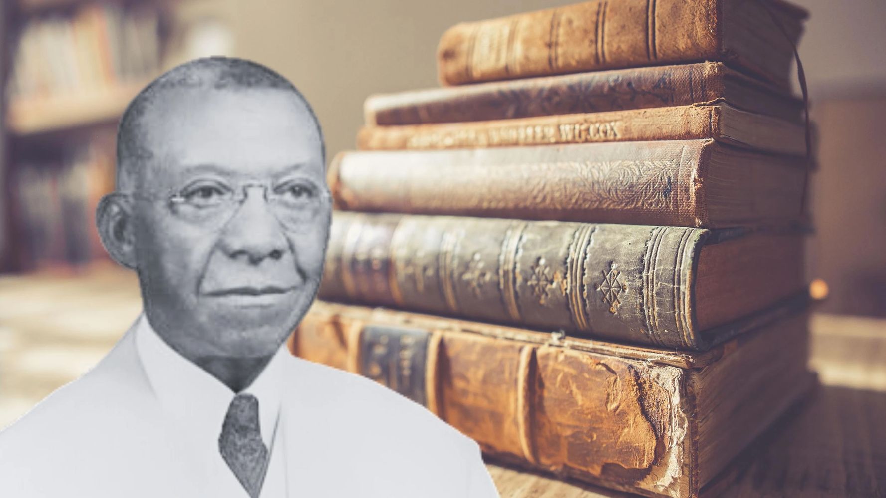 JL Turner Sr against backdrop of old law books stacked