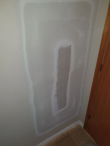 Wall patch repair on interior wall corner.