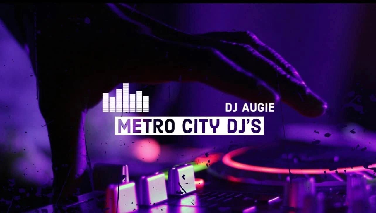 DJ Augie operating Metro City DJ's equipment under purple lighting.
